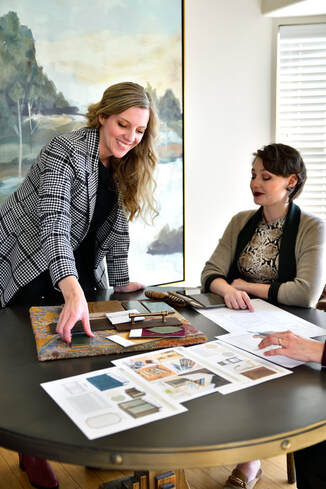 Sonia and Brelynne presenting finishes and concepts to a client