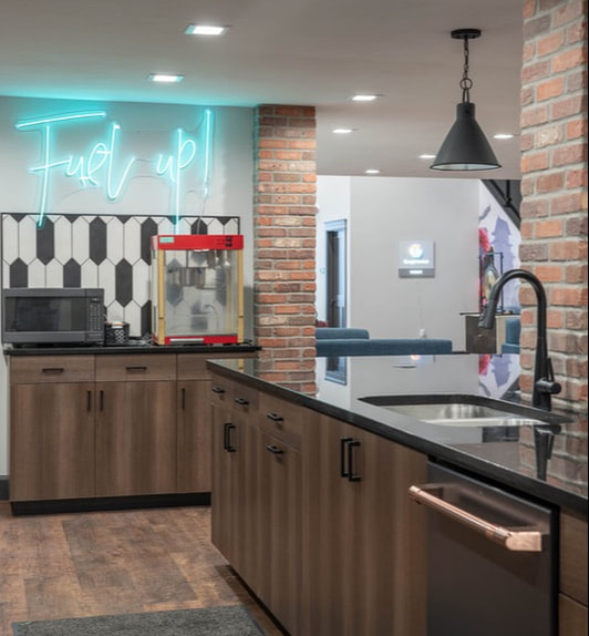 Contemporary industrial kitchen with neon Fuel Up sign